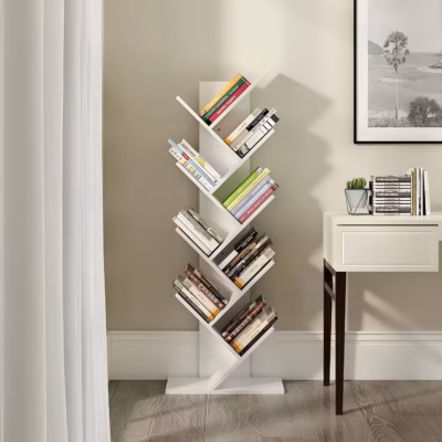 White Branch Book Tower featuring a bright white vertical column with multiple tilted branch-like shelves holding books, anchored by a heavy square base.