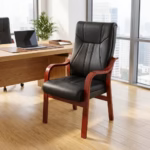 Executive office leather guest chair with black padded high back, cushioned seat, curved wooden armrests and matching wooden legs.
