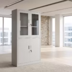 Half glass metallic office cabinet with lockable glass doors, steel storage compartment, adjustable shelves, and light-grey finish.