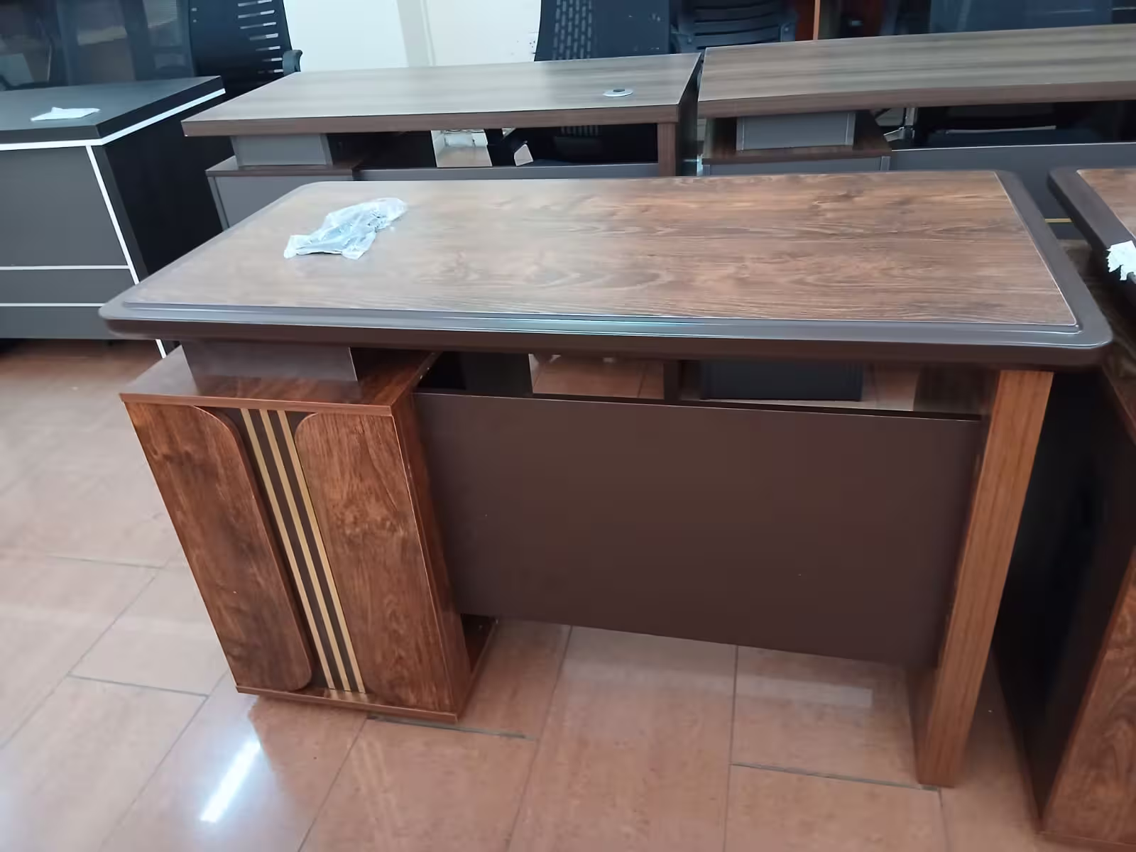 1.2M modern executive office desk with walnut wood finish, lockable drawers, modesty panel, and spacious work surface.