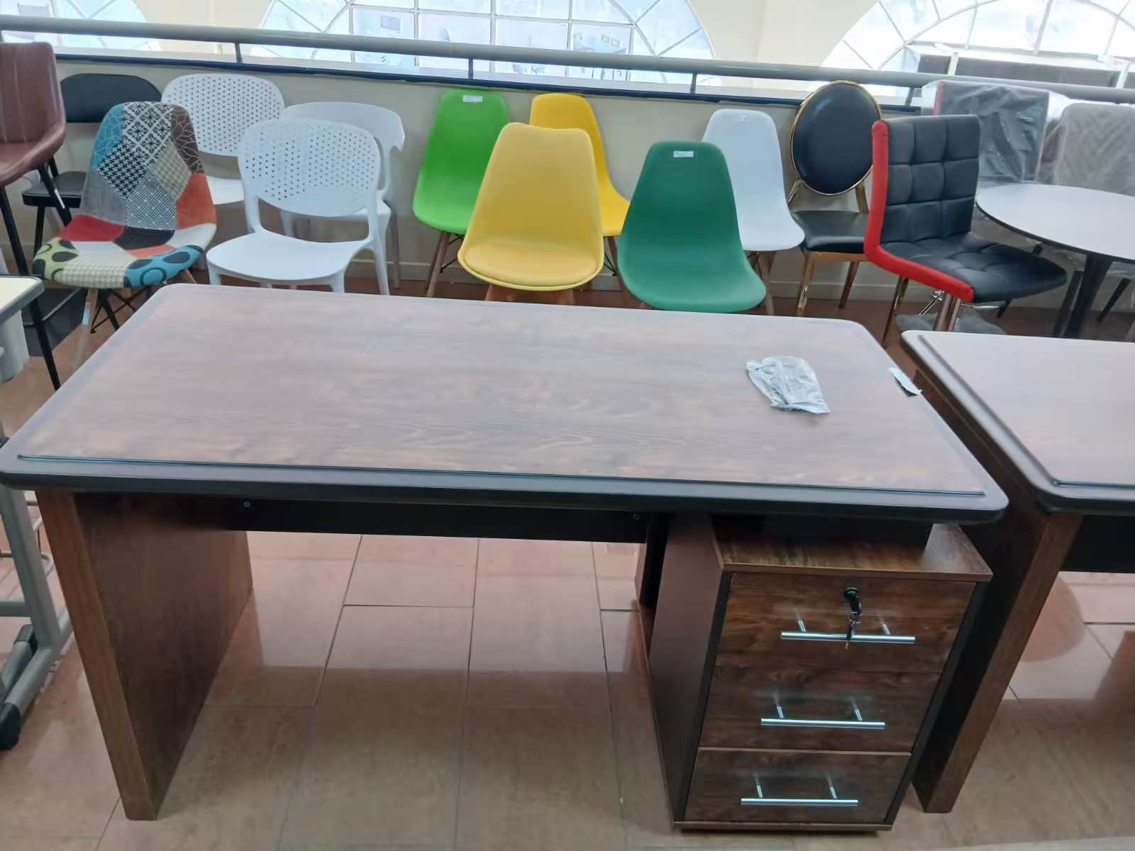 1.2M modern executive office desk with walnut wood finish, lockable drawers, modesty panel, and spacious work surface.