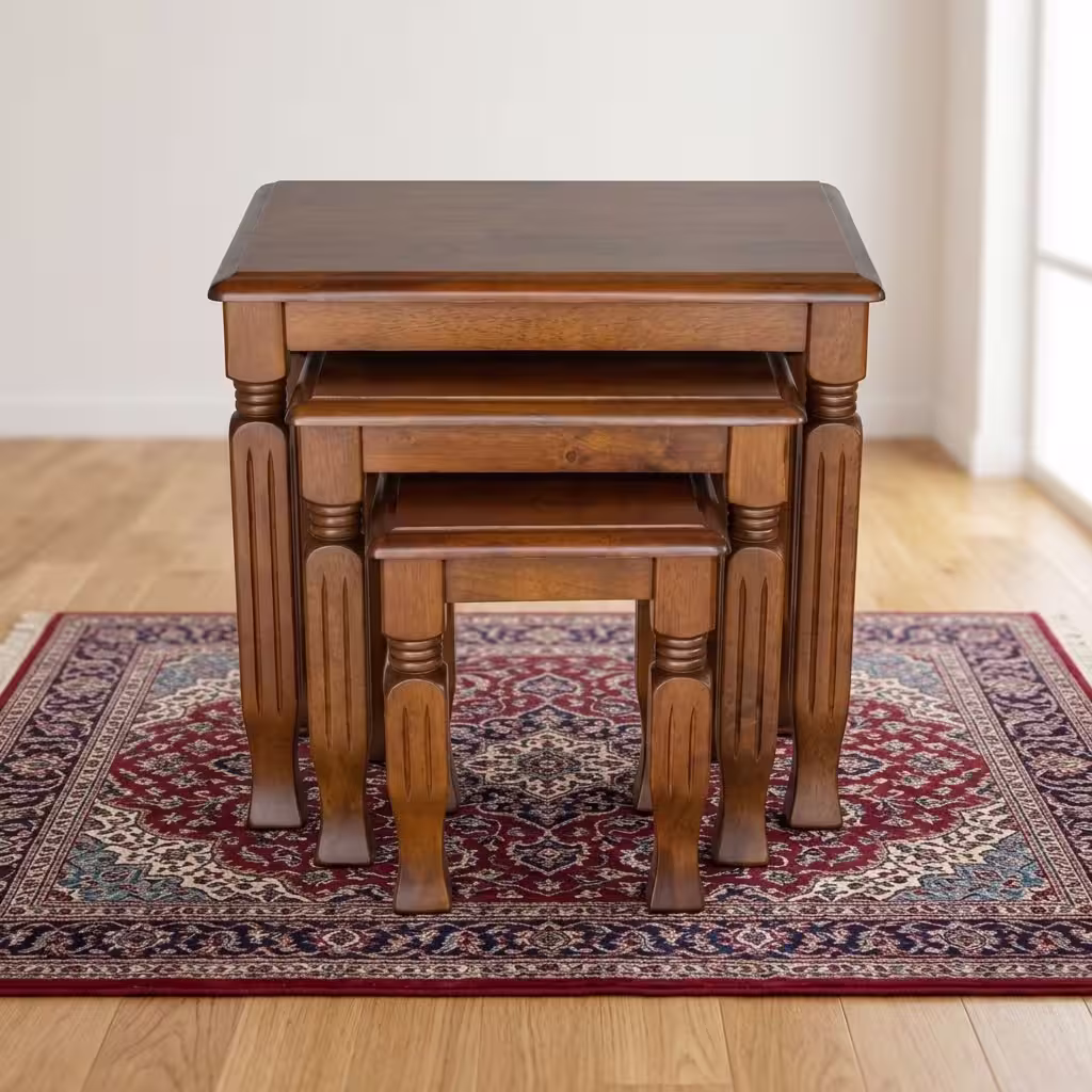 3 piece nest of stools with rich mahogany wood finish, carved wooden legs, and space-saving nesting design.