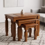 3 piece nest of stools with rich mahogany wood finish, carved wooden legs, and space-saving nesting design.