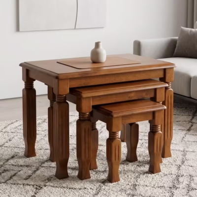 3 piece nest of stools with rich mahogany wood finish, carved wooden legs, and space-saving nesting design.