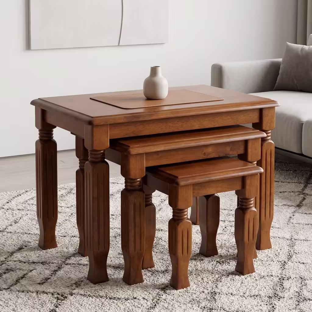 3 piece nest of stools with rich mahogany wood finish, carved wooden legs, and space-saving nesting design.