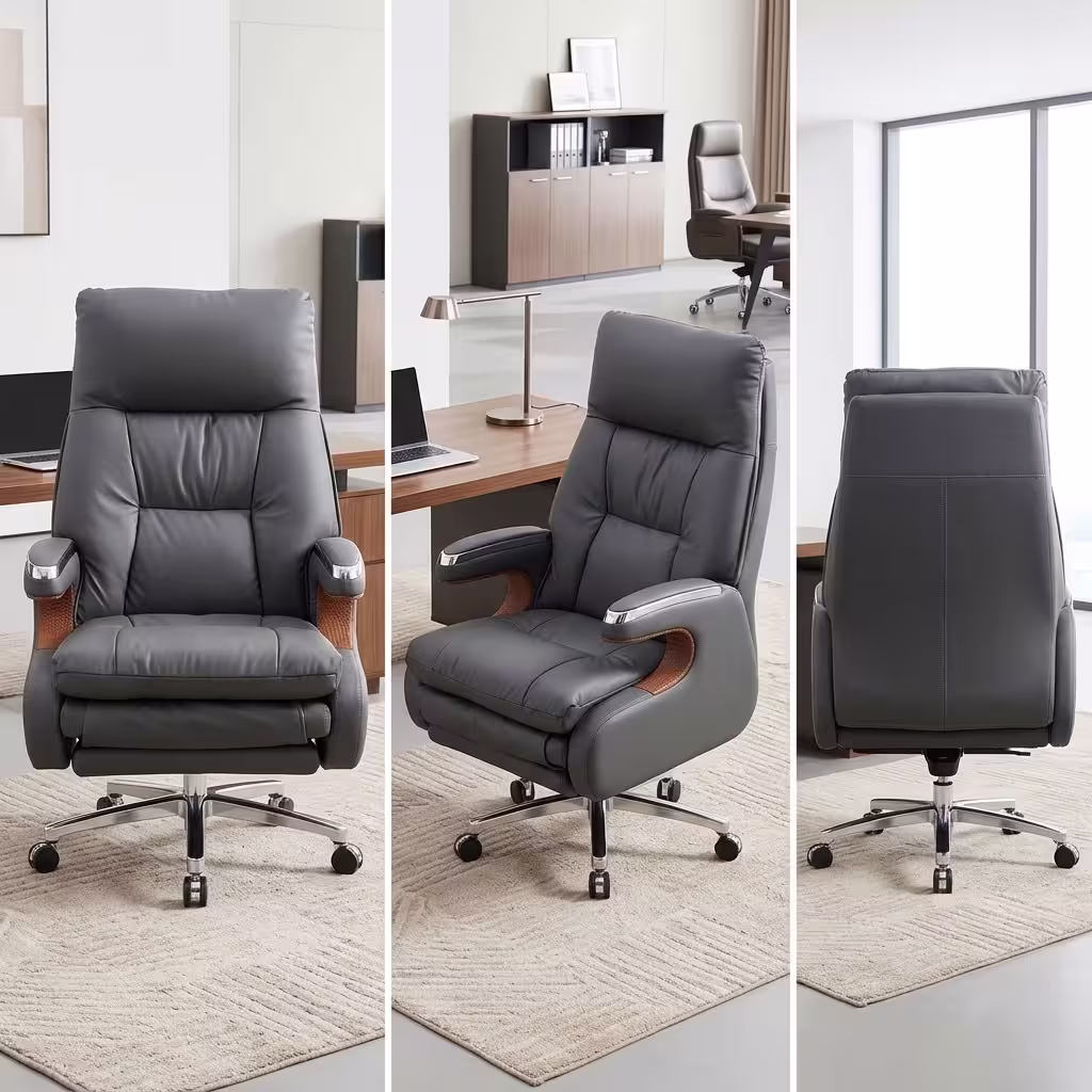 Executive leather office chair with reclining backrest, extendable footrest, padded armrests, chrome base, and premium grey upholstery.