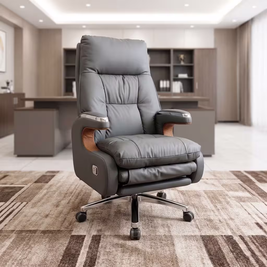 Executive leather office chair with reclining backrest, extendable footrest, padded armrests, chrome base, and premium grey upholstery.