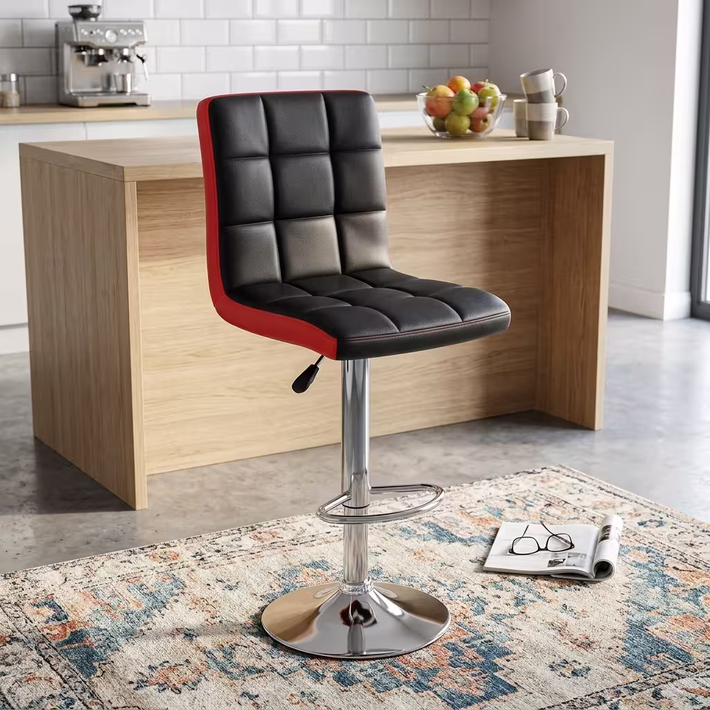 Height adjustable barstool with black and red padded leather seat, chrome pedestal base, swivel function, and footrest.