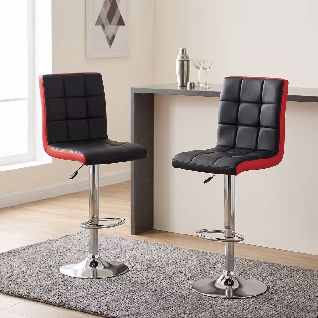 Height adjustable barstool with black and red padded leather seat, chrome pedestal base, swivel function, and footrest.