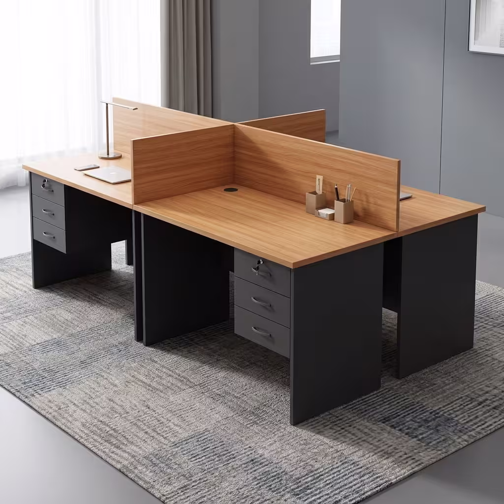 Customized 4 way workstation with privacy partitions, drawer pedestals, cable management ports, and four individual workspaces.